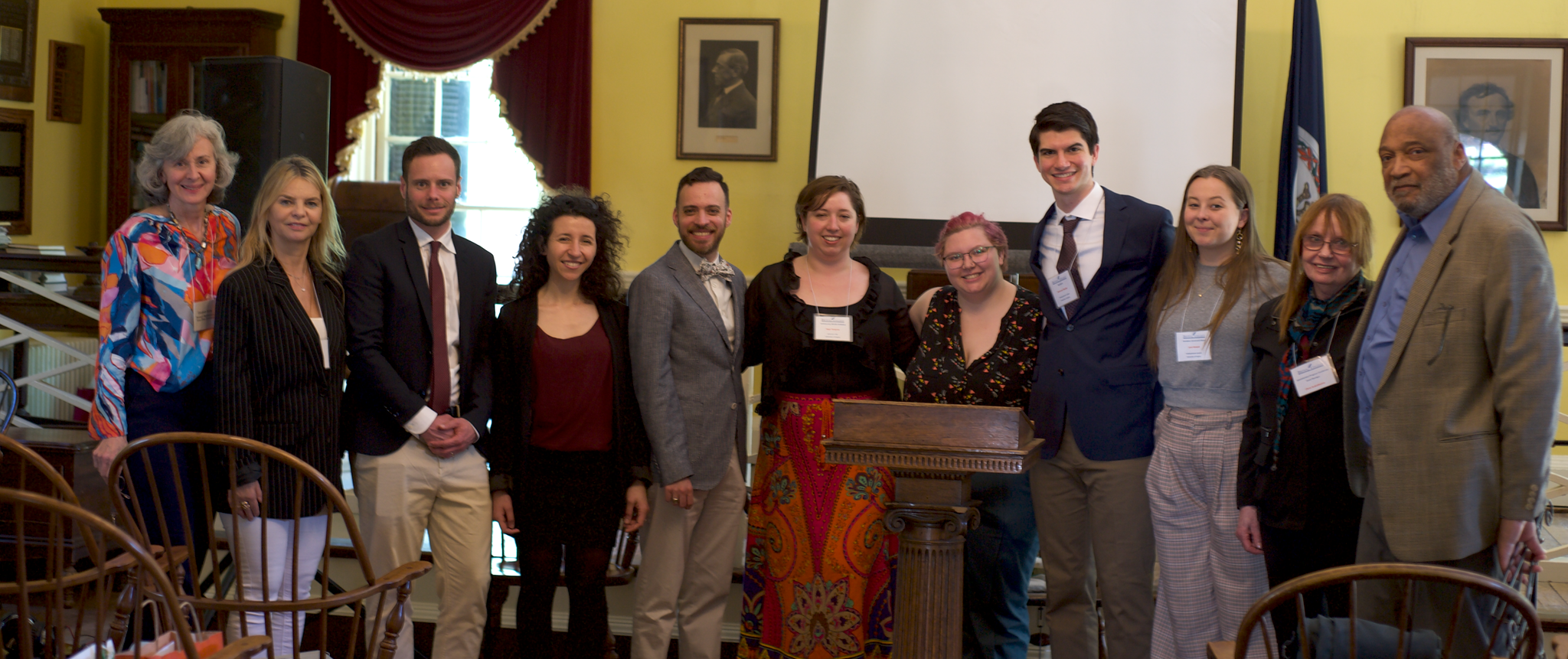 Notable figures from the Sister Revolutions launch standing together